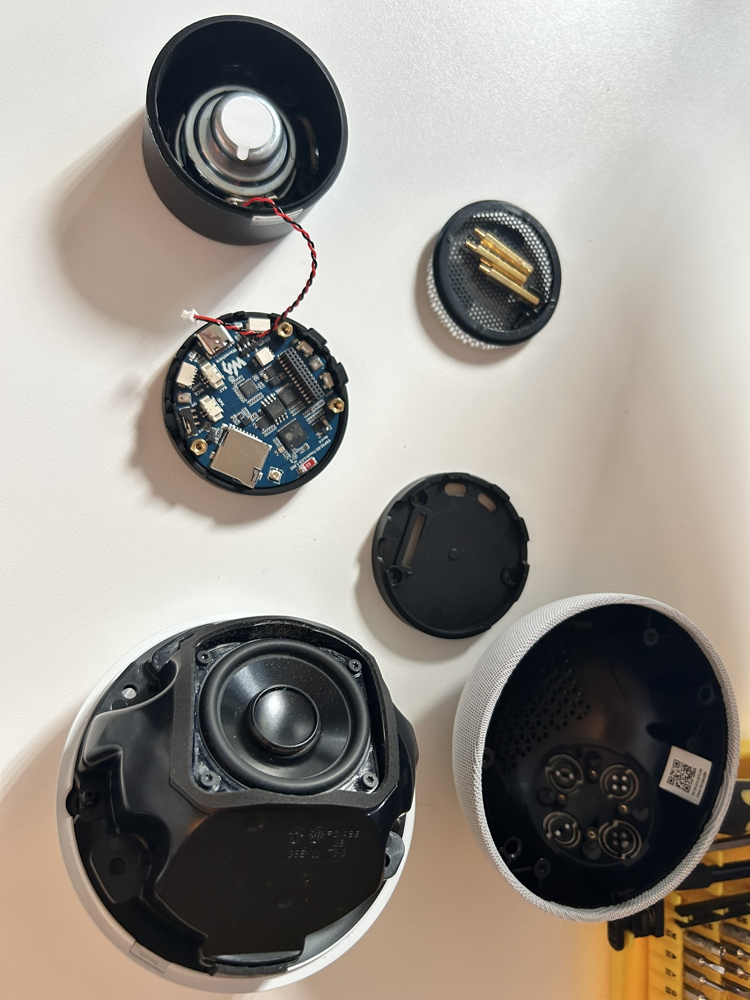 Echo Dot speaker alongside a Waveshare ESP32-S3 audio board