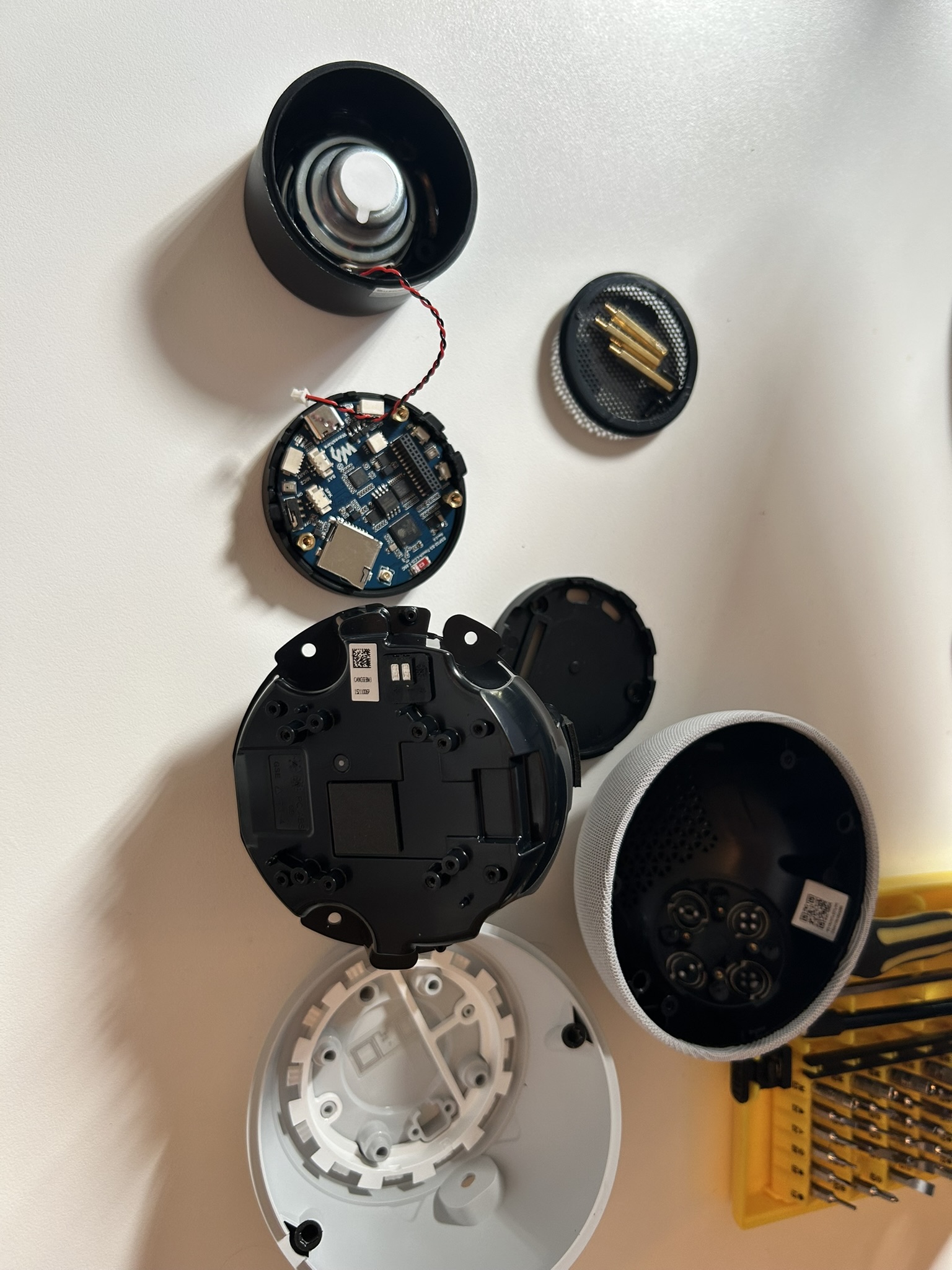 The internal plastic speaker box with two metal pads