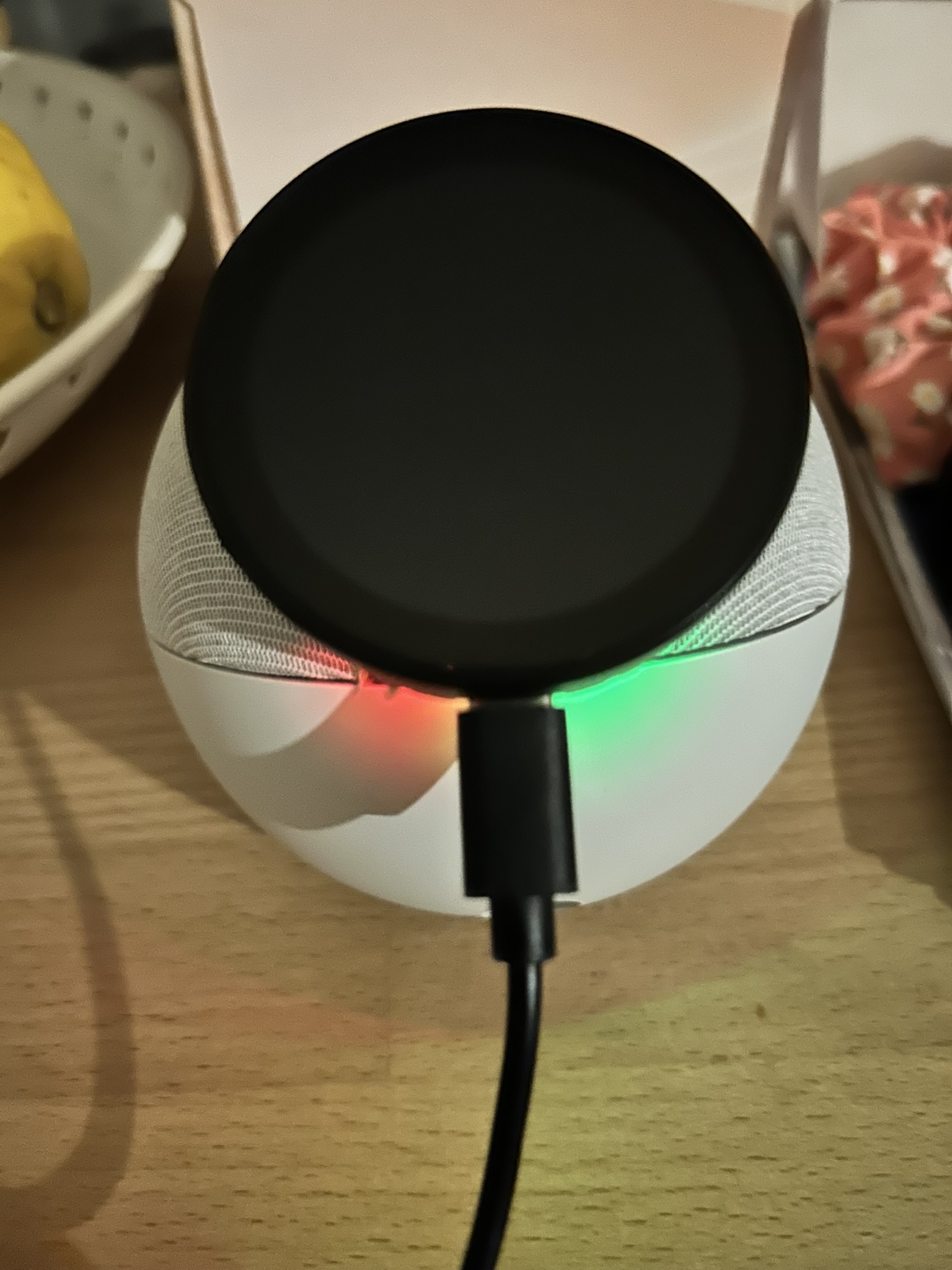 Finished modified Echo Dot with a black ESP32-S3 display attached to the top and USB-C power connected